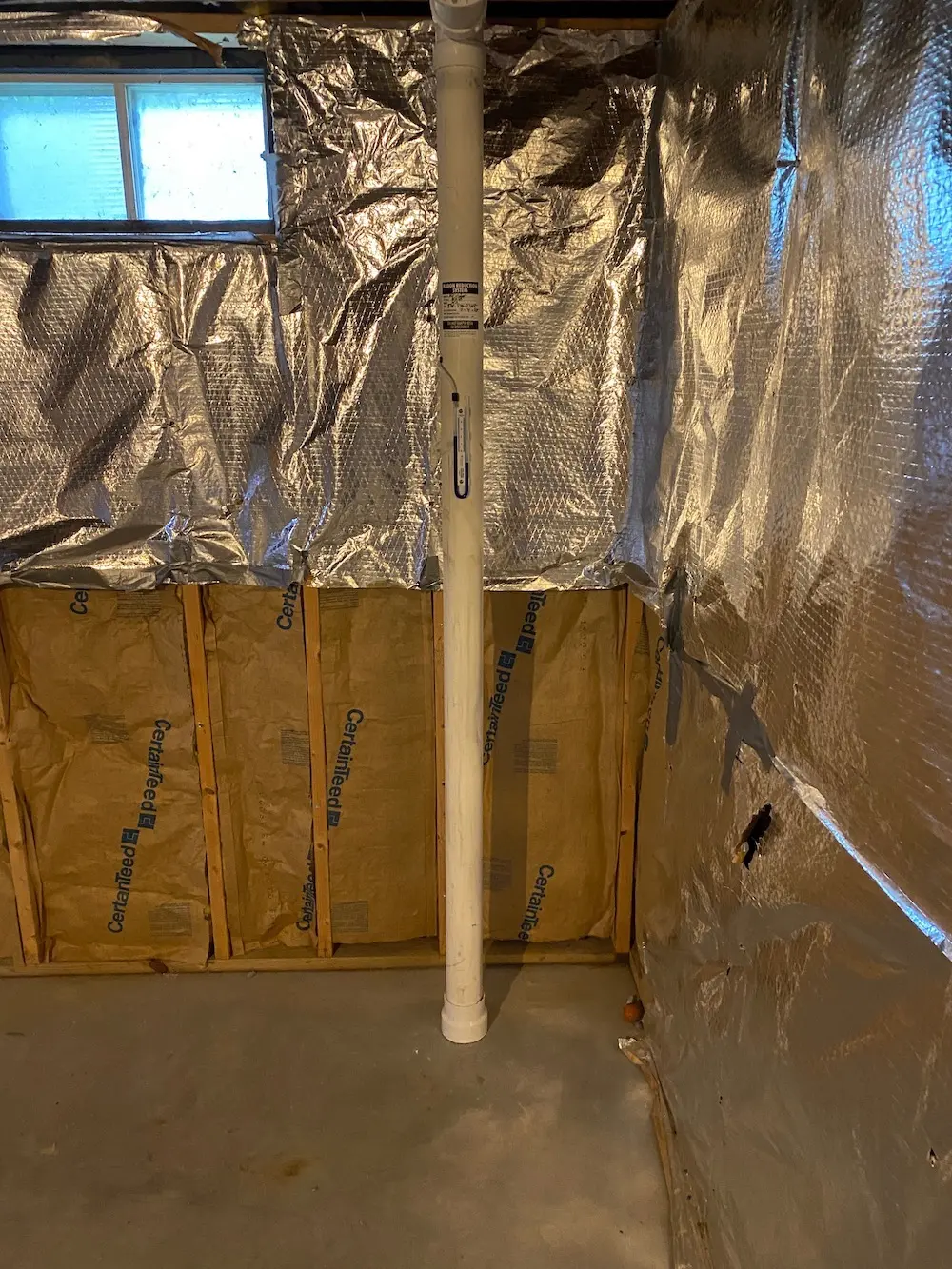 Radon mitigation system in a Clifton Park basement